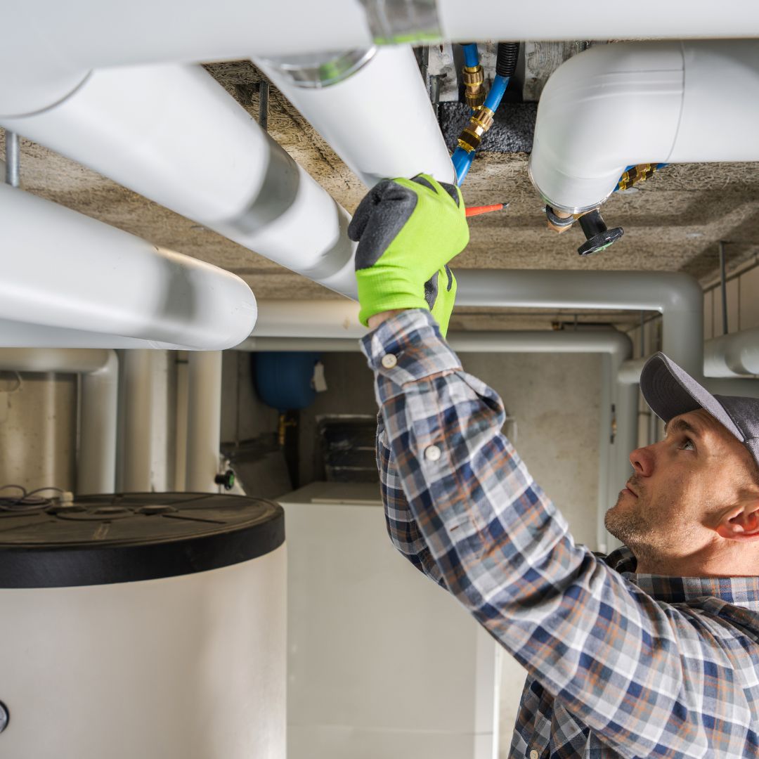plumber working on ceiling
