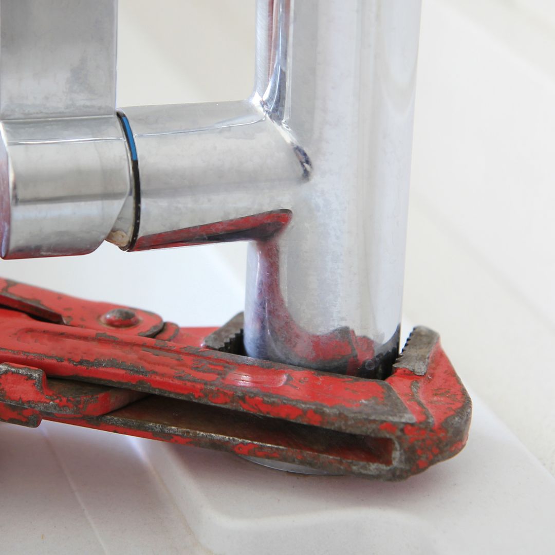 wrench around sink faucet