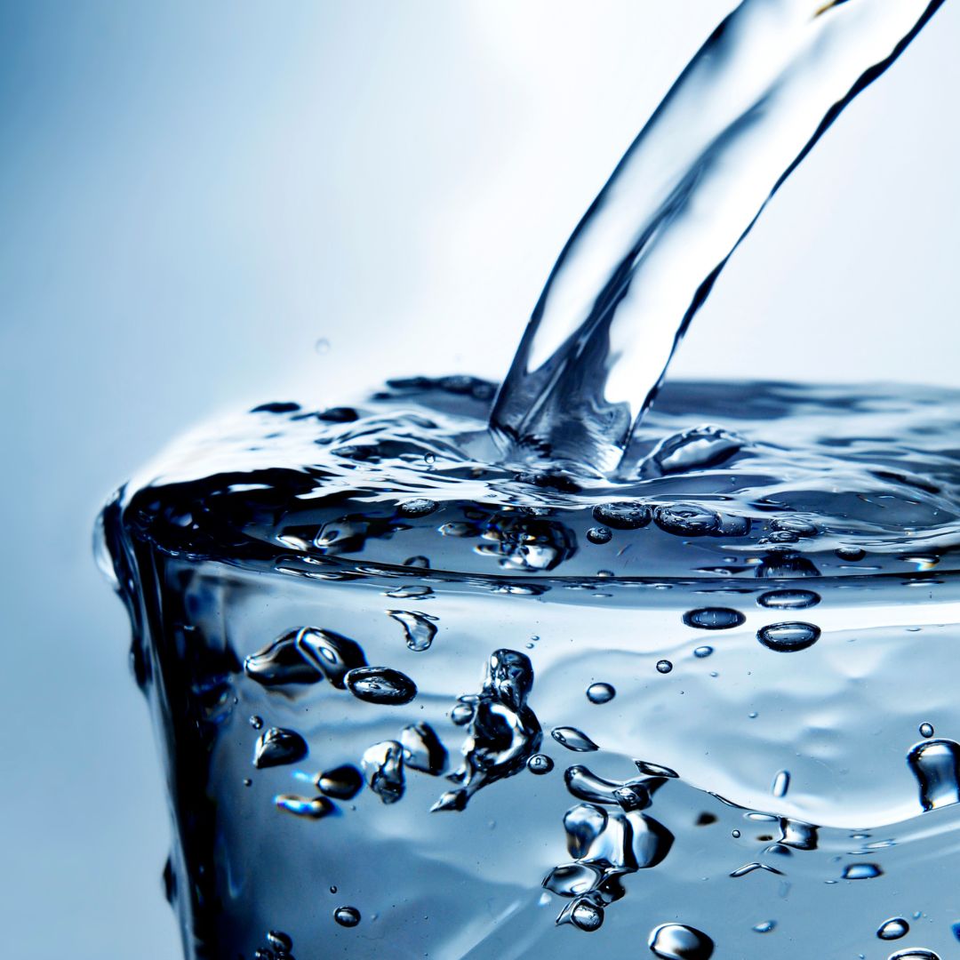 close of up glass over flowing with water