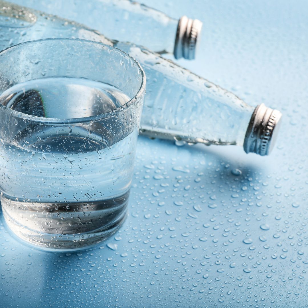 clean water next to glass bottles