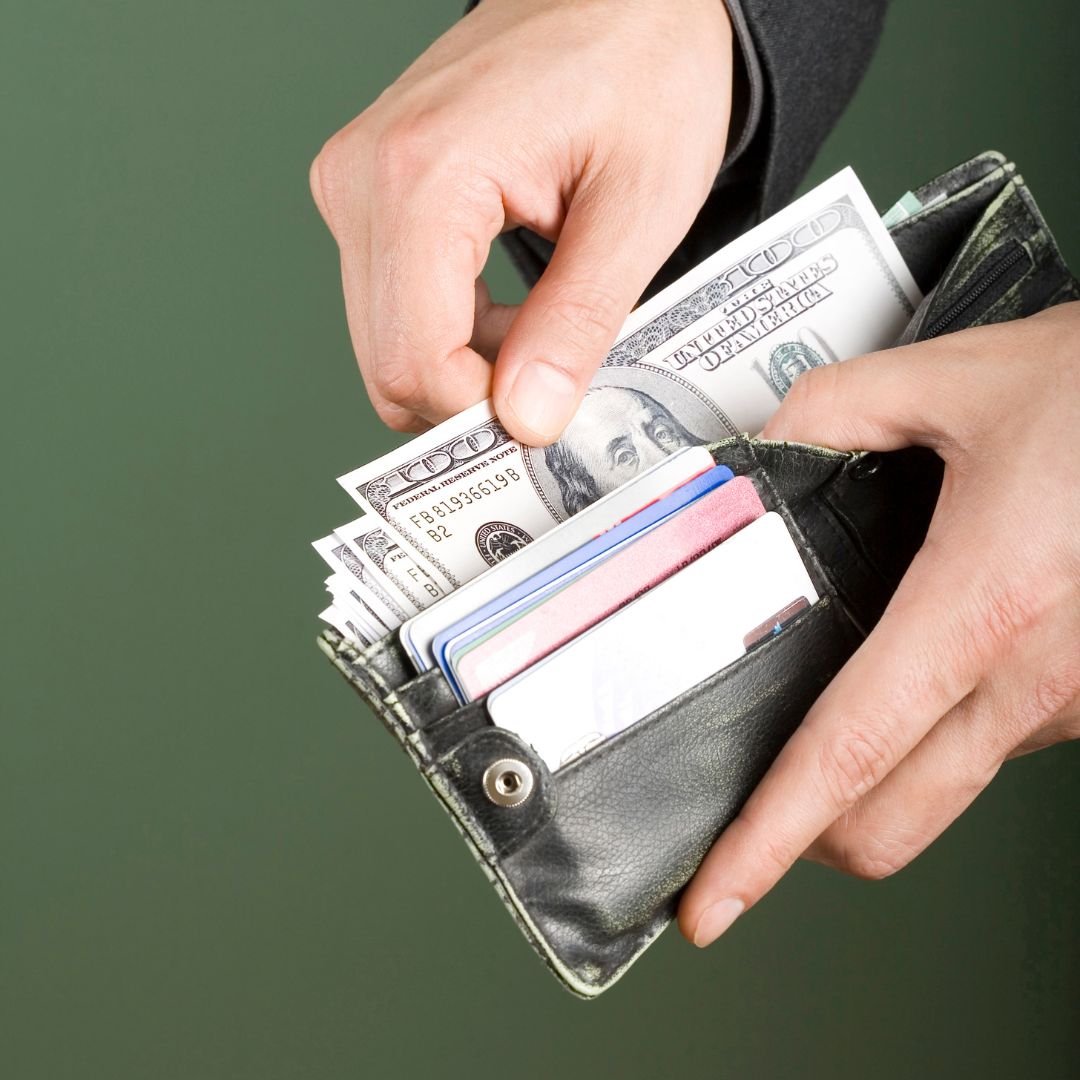 pulling money out of wallet